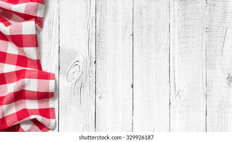 Red Picnic Tablecloth On White Wood Table Background