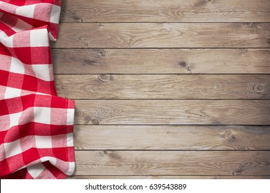 Red Picnic Tablecloth On Wood Table Background