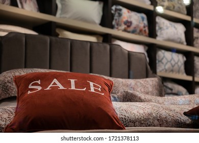 Red Pillow On The Big Bed With The Words Sale, The Concept Of Trading Pillows And Bedding.