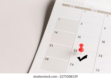 Red pin and arrow symbol on calendar. Confirmation of appointment or meeting concept. - Shutterstock ID 2275308139