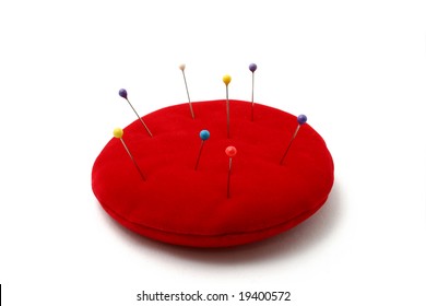 A Red Pin Cushion Isolated On White Background