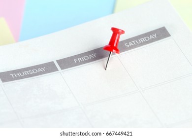 Red Pin Lace On Friday Of Calendar In Notebook