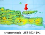 A red pin marks Surabaya on a detailed map of East Java, Indonesia.  A visual guide for travel planning