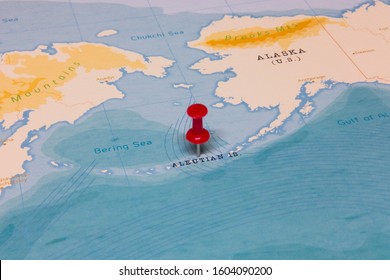 A Red Pin On Aleutian Islands Of The World Map