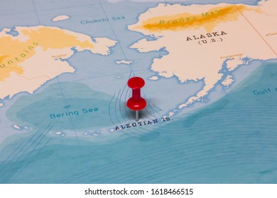 A Red Pin On Aleutian Islands Of The World Map