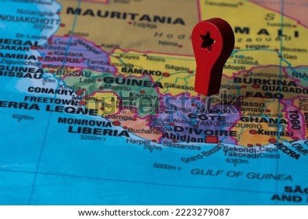 Red pin, point on the map of Cote d'ivoire. Concept travel background