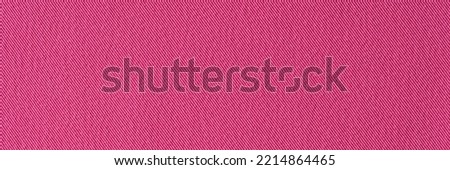 Red pink denim textile background. fabric background surface texture concept