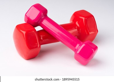 Red And Pink Gym Weight On White Background.