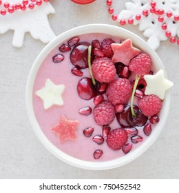 Red Pink Smoothie Bowl With Cherry, Strawberry, Raspberries And Pomegranate , Christmas Fun Festive Food 