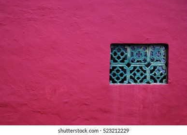 Red plain wall with window