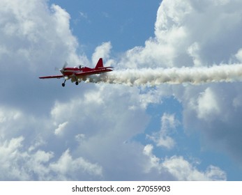 Red plane with white cloud's