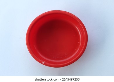 Red Plastic Bowl On A White Background