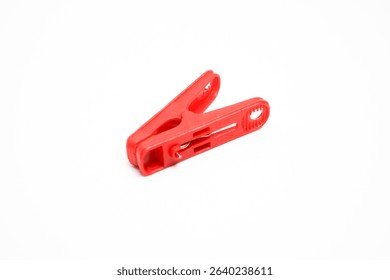 Red Plastic Clothespin Isolated on White Background