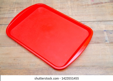 Red Plastic Dining Tray On The Table.