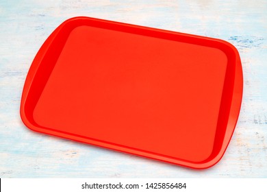 Red Plastic Dining Tray On The Table.