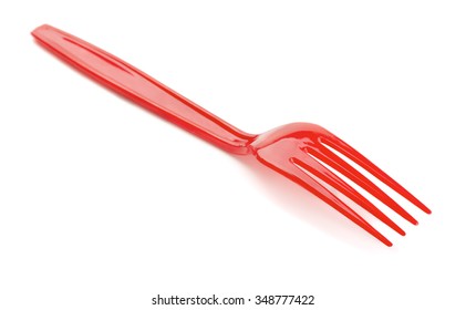 Red plastic fork isolated on white