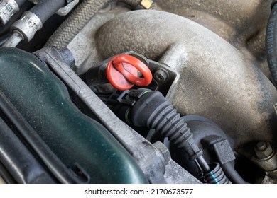 Red Plastic Handle Of A Car Oil Dipstick, Close Up Shot, No People.