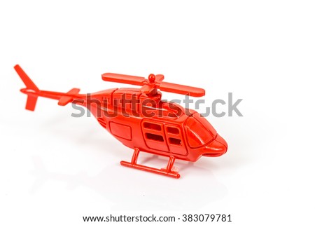 red plastic helicopter toy isolated on white background
