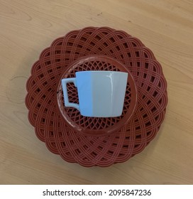 Red Plastic Plate On A Wooden Table