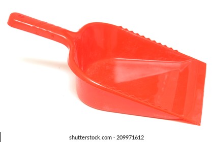red plastic scoop for cleaning on a white background 