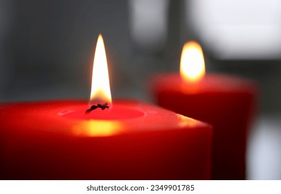 Red plug light in darkness with focus on single glim in foreground