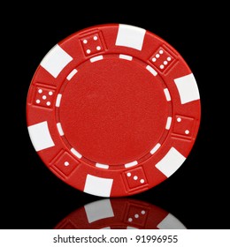 red poker chip over black background