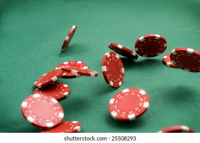  Red Poker Chips Falling At Green Background