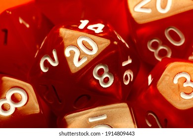 Red Polyhedral RPG Game Dice Set, D20 Dice Macro, Extreme Closeup. Role Playing Board Games, Tabletop Fantasy Games Conceptual. Geek, Nerd Culture, Randomness, Probability And Chances Abstract Concept