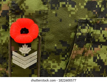 Red Poppy On The Canadian Military Uniform. Canadian Soldiers. Army Of Canada. Remembrance Day. Poppy Day. 