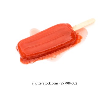 Red Popsicle Melting On A White Background