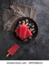 Red Popsicle On Dark And Moody Background