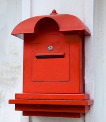 Red Postbox  On White Wall Background