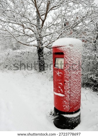   A Red Postbox in the Snow                            