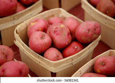 Red potatoes in baskets at market - Shutterstock ID 56081341