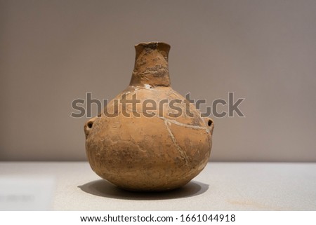 Red Pottery Ewer with Small Mouth, Double Handles, Long Neck and Swelling Belly. Ancient China, Early or Middle Neolithic. Unearthed from Wuan, Hebei Province.
