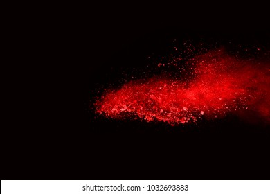 Red Powder Explosion On Black Background.