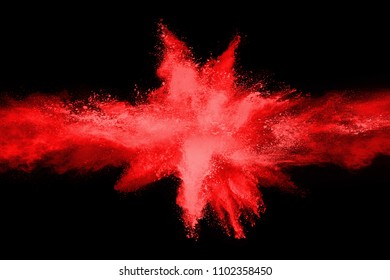 Red Powder Explosion On Black Background.