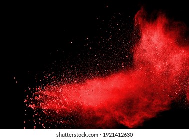 Red Powder Explosion On Black Background. Colored Cloud. Colorful Dust Explode. Paint Holi.