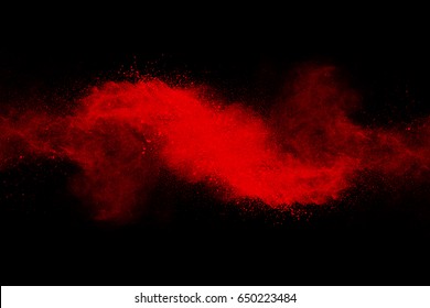 Red Powder Explosion On Black Background.