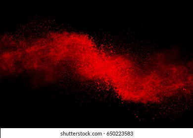 Red Powder Explosion On Black Background.