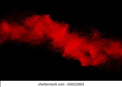 Red Powder Explosion On Black Background.