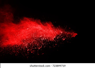 Red Powder Explosion On Black Background.