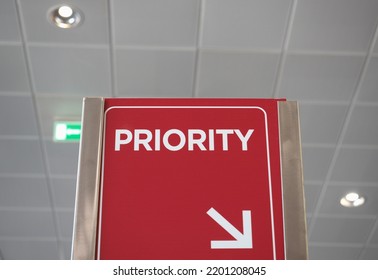 Red Priority Queue Sign At Airport Boarding