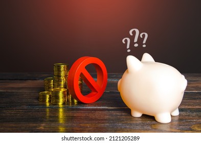 Red prohibition sign NO separates money and piggy bank. Freezing, confiscation, blocking of assets. Suspicious transactions. Sanctions, economic embargo. Savings. Loan disapproval. Bad credit history.