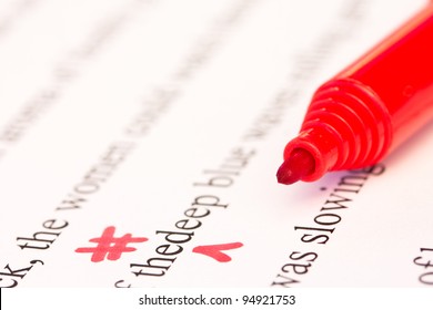 Red Proofreading Marks and Pen Closeup