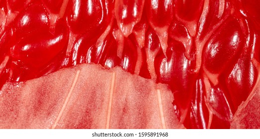 Red pulp pomelo as a background. Macro