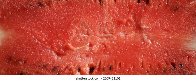 Red Pulp Of Ripe Watermelon Texture. Background Red Pulp Of Ripe Watermelon With Pits.	