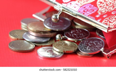 Red purse with coins