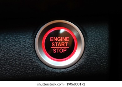 Red Push Engine Start And Stop Button On Car. New Technology Of Car. Transportation And Sefety Concept.