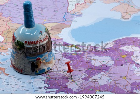 Red push pin on the map, Red push showing location of Pamukkale, Denizli,  city of Turkey, on the map with travel icon of famous for its travertines, concept idea photo. 